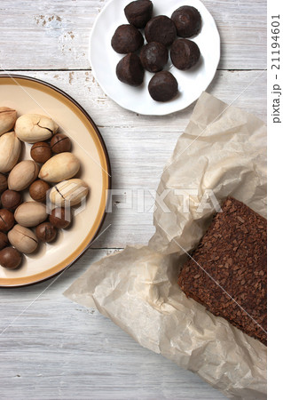 Nuts, truffle candy and chocolate cake  21194601