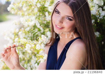 Beautiful girl with white flowers Beautiful girl with white flowers 21196840
