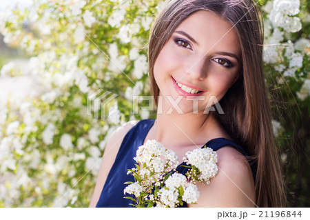 Pretty teen girl with white flowers Pretty teen girl with white flowers 21196844