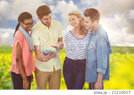 Composite image of happy creative team using a tablet pc 21210027