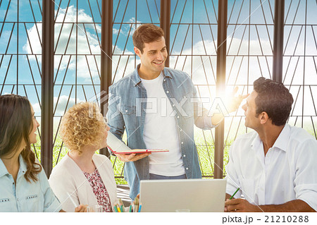 Composite image of group of young colleagues in a meeting Composite image of group of young colleagues in a meeting 21210288