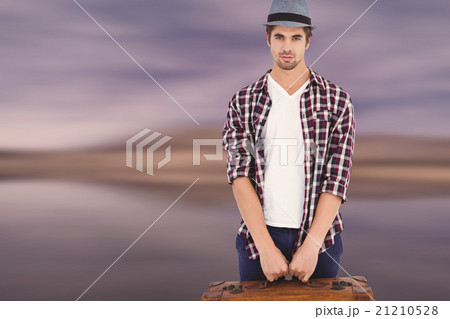 Composite image of confident man holding briefcase Composite image of confident man holding briefcase 21210528