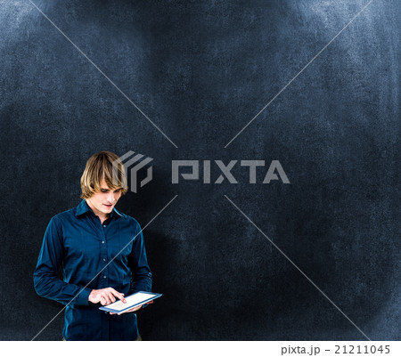 Composite image of hipster businessman using tablet 21211045