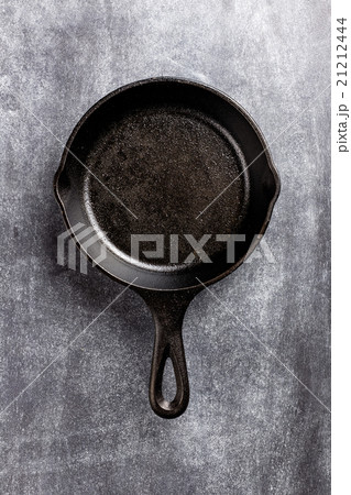 cast iron pan on dark background cast iron pan on dark background 21212444