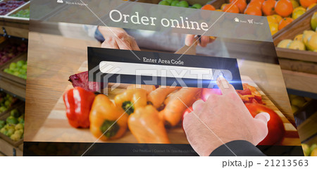 Composite image of businessman pointing with his finger 21213563