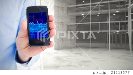 Composite image of businessman showing his smartphone to camera Composite image of businessman showing his smartphone to camera 21213577