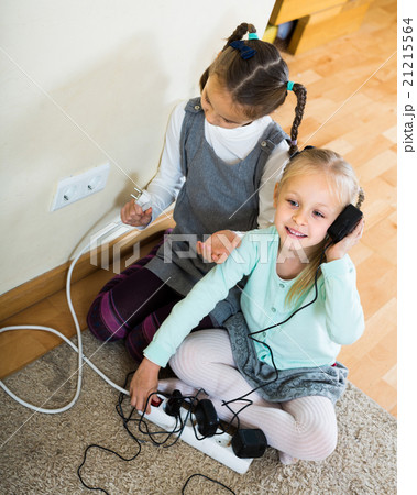 children playing with sockets and electricity indoors children playing with sockets and electricity indoors 21215564