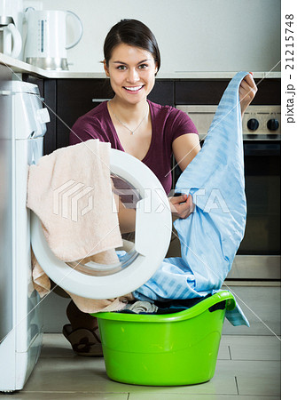 Young woman near washing machine Young woman near washing machine 21215748