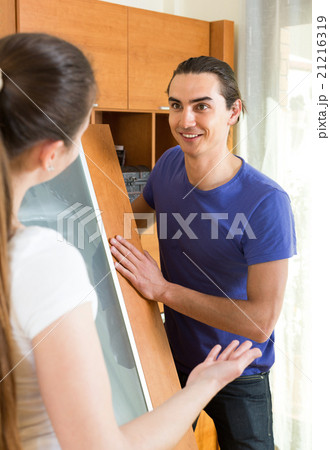 Happy couple doing improvement Happy couple doing improvement 21216319
