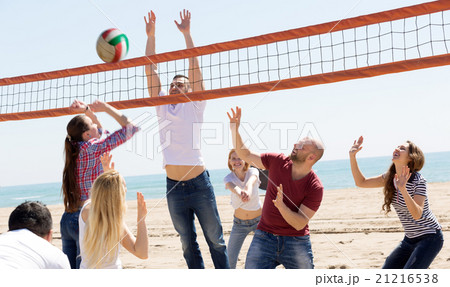 People play volleyball on beach People play volleyball on beach 21216538