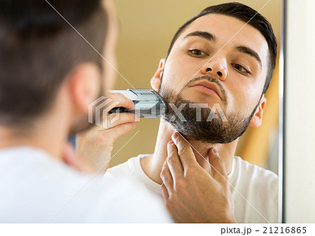 guy shaving by electric shaver guy shaving by electric shaver 21216865