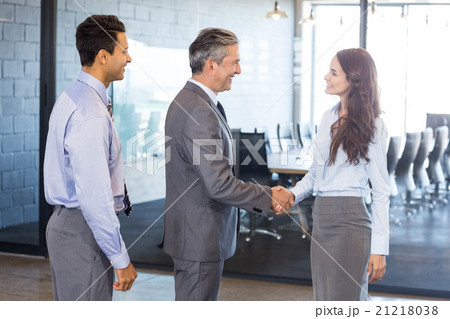 Business team interacting in office 21218038