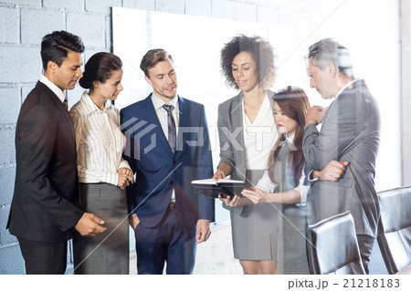 Businesspeople interacting in conference room Businesspeople interacting in conference room 21218183