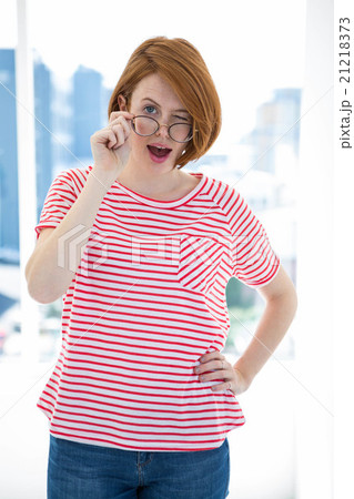 Cute red haired hipster with glasses 21218373