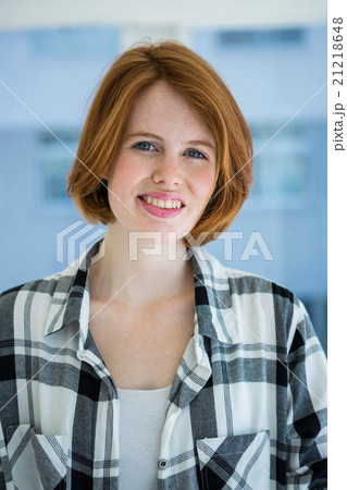 Red haired hipster smiling at camera 21218648