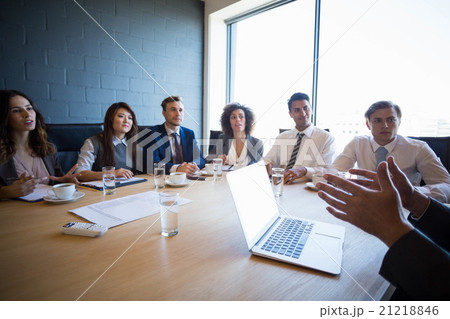 Businesspeople having a discussion in conference room Businesspeople having a discussion in conference room 21218846