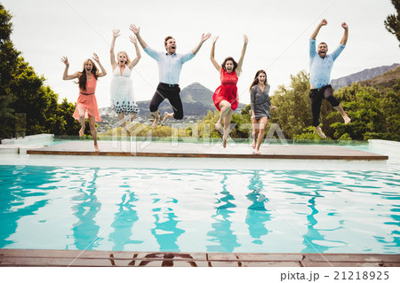 Young friends having fun at swimming pool 21218925