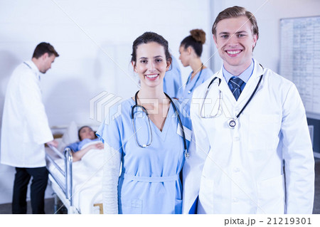 Portrait of doctors smiling at camera Portrait of doctors smiling at camera 21219301