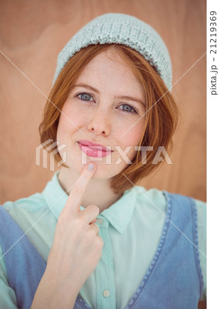 smiling hipster woman wearing a beanie hat 21219369