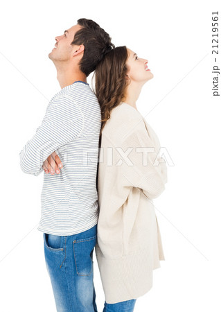 Couple standing back to back 21219561
