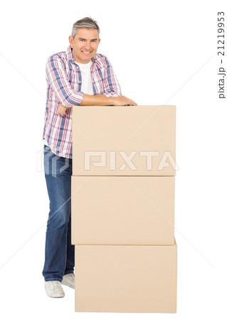Happy man posing with moving boxes 21219953