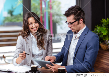 People using tablet and notebook People using tablet and notebook 21220020