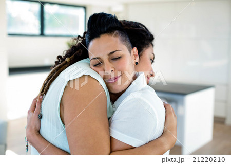 Lesbian couple embracing each other 21220210