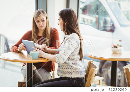 Friends using tablet and having coffee 21220269