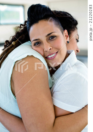 Lesbian couple embracing each other 21220283