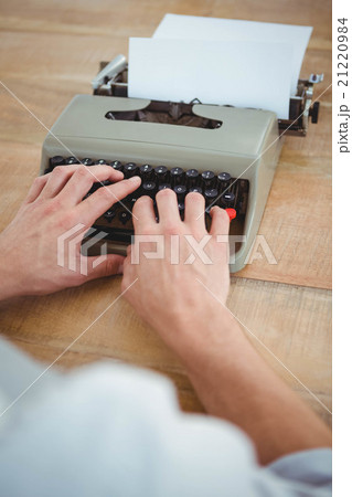 masculine hands typing on old typewriter masculine hands typing on old typewriter 21220984