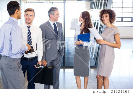 Business team interacting in office Business team interacting in office 21221162