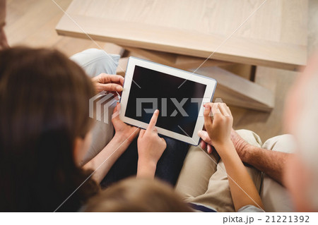 Children using tablet with their grandparents 21221392