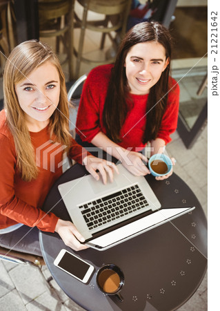 Friends using laptop together 21221642