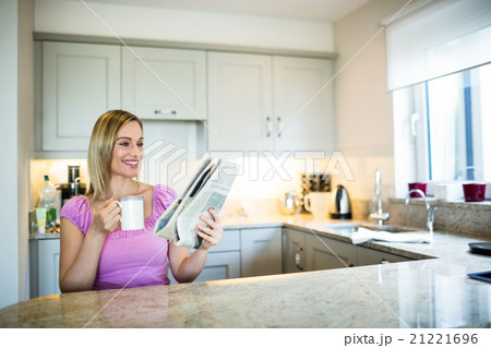 Pretty blonde woman having coffee Pretty blonde woman having coffee 21221696