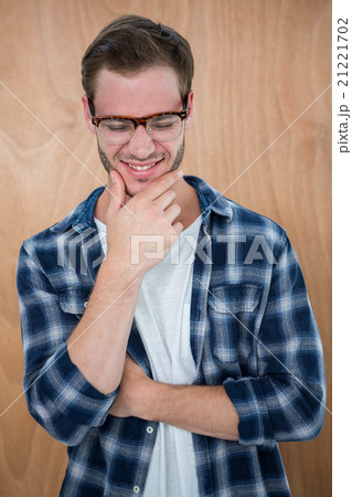 Handsome hipster with glasses with hand on chin Handsome hipster with glasses with hand on chin 21221702