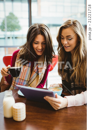Friends using tablet together 21221718
