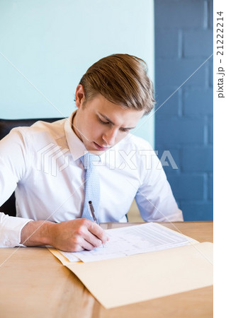 Young businessman in business meeting Young businessman in business meeting 21222214