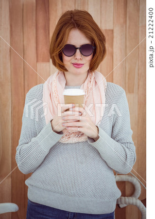 Red haired hipster drinking coffee 21222400
