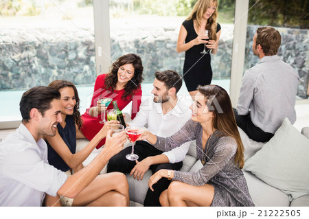 Group of friends toasting cocktail drinks 21222505