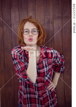 beautiful hipster woman blowing a kiss at the camera beautiful hipster woman blowing a kiss at the camera 21222508