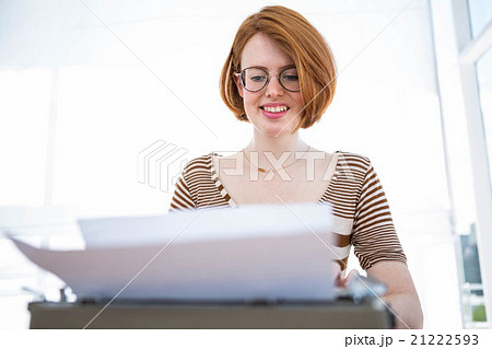hipster typing on a typewrite hipster typing on a typewrite 21222593