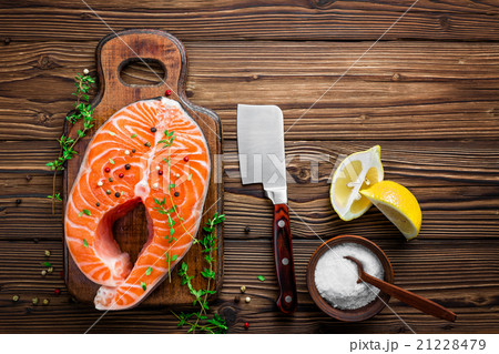 raw salmon fish steak on wooden rustic background 21228479