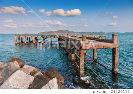 old pier bridge in the calmness sea with blue sky 21229112