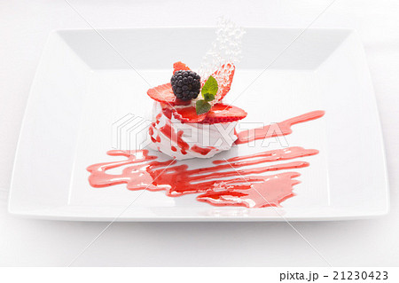 Mousse, cream, decorated with berries and jam 21230423