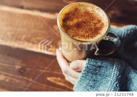 Girl holding cup of coffee in morning, copy space Girl holding cup of coffee in morning, copy space 21231748