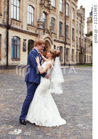 The bride groom gently embraced The bride groom gently embraced 21231965