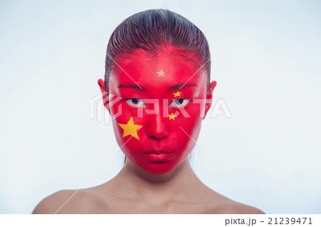 Asian girl with a Chinese flag on the face Asian girl with a Chinese flag on the face 21239471