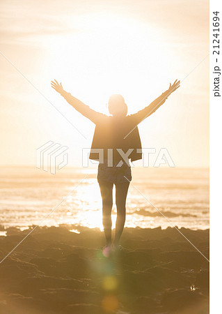 Free woman enjoying freedom on beach at sunset. 21241694