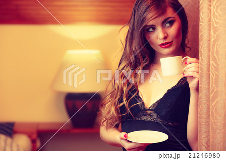 Alluring woman with cup tea. 21246980