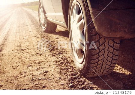 car tire on dirt road 21248179